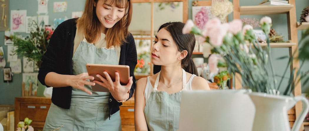 Two women looking at tablet